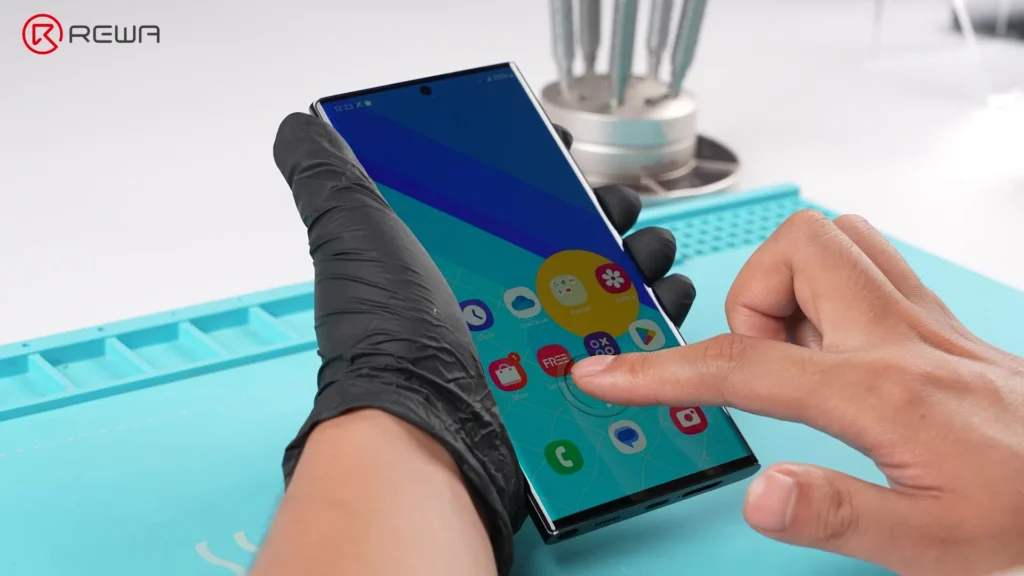 the evolution of samsung aftermarket screens: from incell lcd to advanced 1:1 oled A finger activates the under-display fingerprint sensor on a Samsung smartphone with an aftermarket OLED screen
